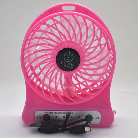 Mini fan. Portable battery operated hot pink small table